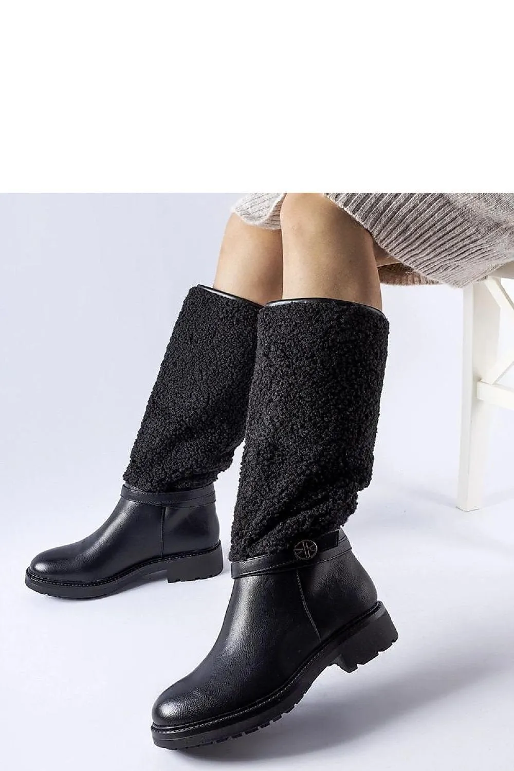Black boots decorated with fur
